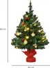 A small, decorated Christmas tree on a white background. Podgląd zdjęcia produktu