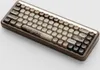 A close-up, angled view of a mechanical keyboard with a wooden case and unique keycaps. Produktbild-Vorschau