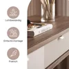 A close-up view of a console table with drawers, featuring decorative elements and icons highlighting product features. Produktbild-Vorschau