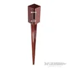 A brown metal post anchor with a pointed base and a square top section secured by bolts. Produktbild-Vorschau
