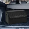 A black quilted trunk organizer with a lid is placed on the floor of a car's trunk. Náhľad obrázku produktu