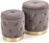 Two upholstered ottomans with tufted tops and gold bases are displayed on a white background. Produktbild-Vorschau