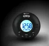 A black digital alarm clock with a blue illuminated display is shown against a dark, gradient background. Produktbild-Vorschau