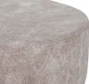 A close-up view of the textured surface of a round ottoman or stool. Anteprima dell’immagine prodotto