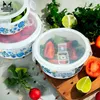 Food containers with fresh ingredients like tomatoes and limes. Produktbild-Vorschau