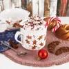 A festive Christmas scene featuring a mug of hot chocolate, gingerbread cookies, and holiday decorations. Náhľad obrázku produktu