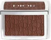 A close-up, top-down view of a Dior bronzer compact. Voir les images du produit