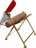 A log is placed on a sawhorse-like stand with a red saw holder. Náhled obrázku produktu