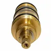 A close-up, front-facing view of a brass faucet cartridge with black O-rings. Produktbild-Vorschau