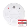A white smoke detector is shown against a white background, with a review badge in the bottom right corner. Produktbild-Vorschau