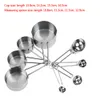 A set of stainless steel measuring cups and spoons arranged in a radial pattern against a white background. Podgląd zdjęcia produktu