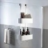 A shower caddy hanging on a glass shower door, with bottles and a washcloth inside. Produktbild-Vorschau