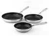 Three stainless steel frying pans of varying sizes are arranged on a white background. Podgląd zdjęcia produktu