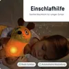 A child sleeping with a stuffed animal that is glowing. Anteprima dell’immagine prodotto