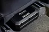 A Pioneer digital bass subwoofer is installed under the seat of a car. Produktbild-Vorschau