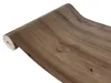 A roll of wood-look adhesive film, unrolled slightly to show the texture. Produktbild-Vorschau