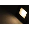 A close-up shot of an LED floodlight emitting a warm white light onto a surface. Produktbild-Vorschau