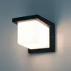 A modern black outdoor wall lamp with a frosted white square diffuser, mounted on a wall. Produktbild-Vorschau