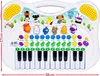 A toy keyboard with animal figures and colorful buttons, displayed against a white background with a decorative sky scene. Anteprima dell’immagine prodotto