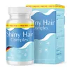 A bottle of Shiny Hair Complex capsules and its packaging are shown against a white background. Produktbild-Vorschau
