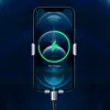 A smartphone is shown being charged wirelessly by a charging cable attached to a car vent mount. Náhled obrázku produktu