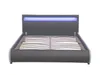 A modern bed frame with a grey upholstered headboard and base, featuring blue LED lighting across the top of the headboard. The slatted bed base is visible. Náhled obrázku produktu