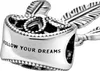 A close-up of a silver charm with feather details and engraved text. Produktbild-Vorschau