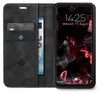 A black flip phone case with card slots and a phone inside displaying the lock screen. Produktbild-Vorschau