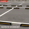 A parking lot with multiple parking stops installed in parking spaces. Náhled obrázku produktu