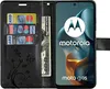 A black wallet-style phone case with cards and money inserted, and a Motorola phone displaying its logo and model name. Produktbild-Vorschau