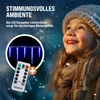 A young girl looking up at blue icicle lights, with a remote control and a plus sign in the foreground. Produktbild-Vorschau