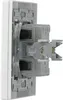 A close-up, side view of the back of a white electrical switch or outlet, showing the internal wiring and mounting mechanism. Produktbild-Vorschau