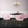 A dining set with pink velvet chairs and a black table, set against a pale pink wall and white wainscoting. Náhled obrázku produktu