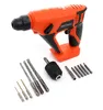 An orange and black cordless hammer drill with various drill bits and accessories laid out in front of it on a white background. Podgląd zdjęcia produktu