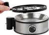 A hand is removing the lid from an electric egg cooker. Produktbild-Vorschau