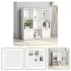 A white modular bookshelf unit is shown in a room setting with some decorative items and books. The collage also includes smaller images of the bookshelf from different angles. Produktbild-Vorschau