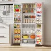 A white kitchen pantry cabinet filled with various food items and kitchenware. Produktbild-Vorschau