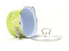 A green pot with a daisy pattern and a glass lid, shown on a white background. Náhľad obrázku produktu