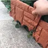Braune Kunststoff-Gartenumrandung in Ziegeloptik, die entlang eines Betonwegs neben grünen Pflanzen installiert wird Náhľad obrázku produktu
