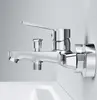 A chrome faucet mounted on a white wall above a white sink. Produktbild-Vorschau