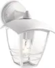 A white outdoor wall light with a clear glass enclosure and a visible light bulb. Anteprima dell’immagine prodotto