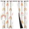Two curtains with a rainbow pattern are displayed, one partially open to reveal a black lining. Podgląd zdjęcia produktu
