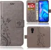 A collage of images showing a phone case from different angles, including its interior with cards and cash, and the back with the camera cutout. Produktbild-Vorschau