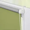 A close-up view of a roller blind mechanism and the top edge of the blind material. Náhled obrázku produktu