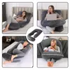 A collage of four images showing a U-shaped pregnancy and nursing pillow in use by women in different scenarios, including resting, working on a laptop, sleeping, and holding a baby. A separate inset shows a close-up of the pillow's shape. Produktbild-Vorschau