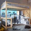 A loft bed with a desk and storage integrated underneath, illuminated by blue LED lights. Náhled obrázku produktu