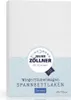 A white baby crib sheet with branding and product information. Produktbild-Vorschau