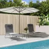 Two lounge chairs and a small table are set up on a patio next to a swimming pool, under a large umbrella. Produktbild-Vorschau