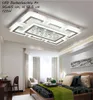 A modern bedroom with a large LED ceiling light fixture. Produktbild-Vorschau