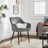 A white cat is resting on a gray upholstered chair in a well-lit room. Produktbild-Vorschau